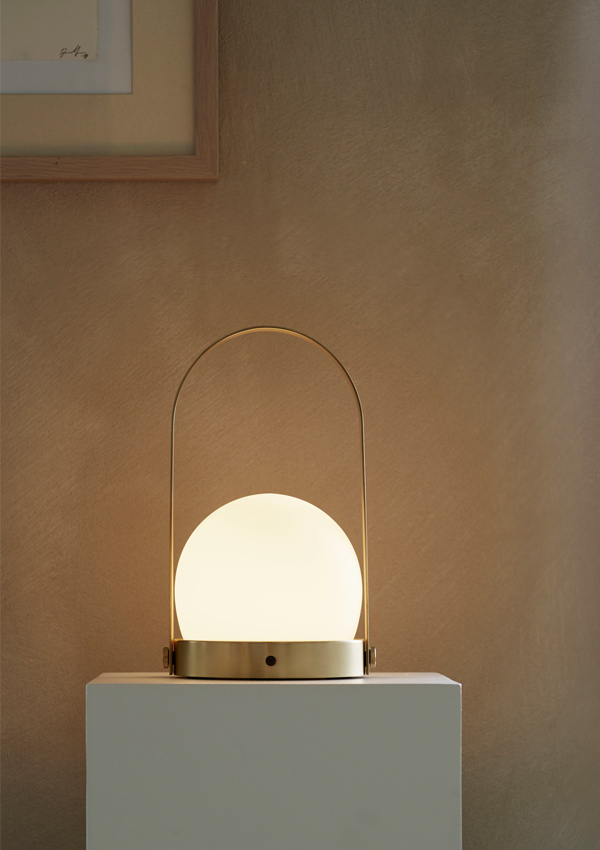 Audo Carrie LED Table Lamp on a plinth