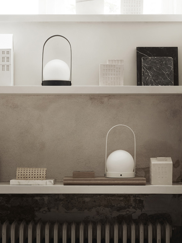 2 Audo Carrie LED Table Lamps on shelving