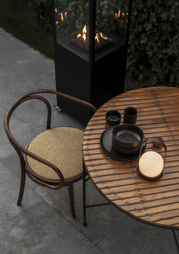 Audo Carrie LED Table Lamp on an outdoor table