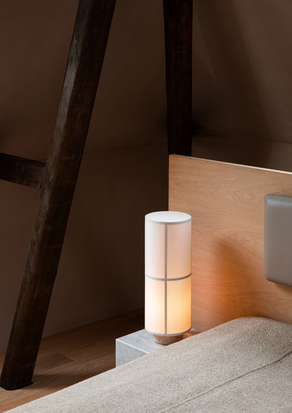 Audo Hashira Table Lamp beside a bed