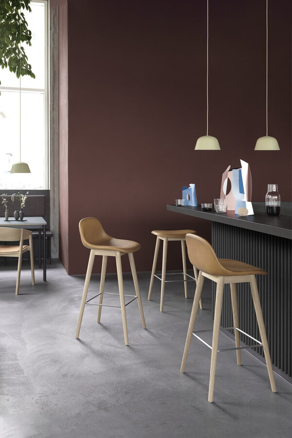 Muuto Fiber Bar Stools with Wood Base at a bar