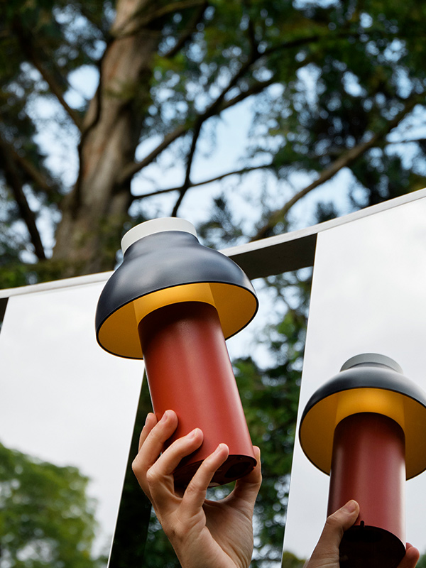 Holding up the Hay PC Portable with mirrored reflections
