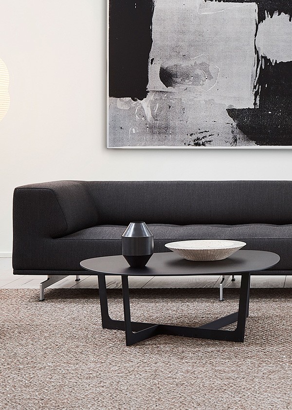Fredericia Insula Table positioned in front of sofa