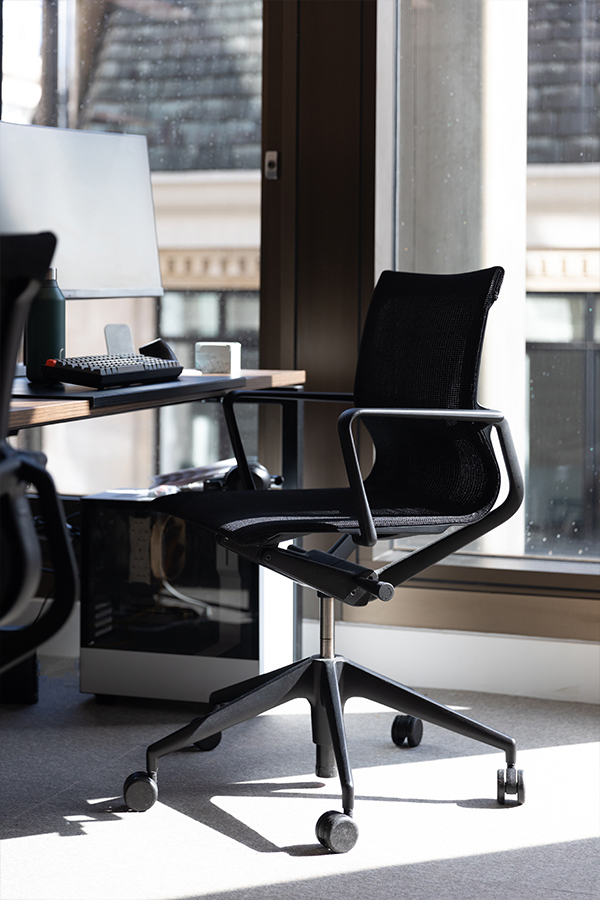Black Vitra Physix Office Swivel Chair at a desk