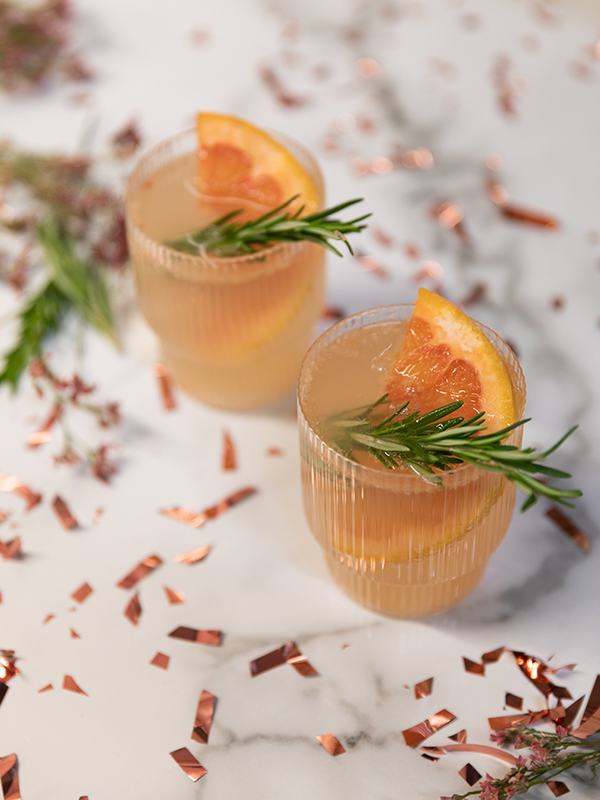 ferm LIVING Ripple Glasses containing Grapefruit & Rosemary Gin Cocktail
