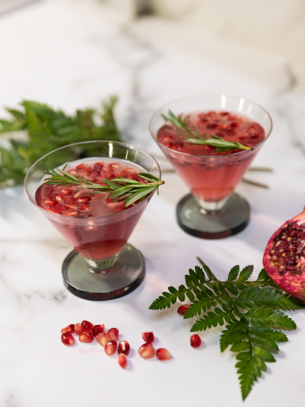 Pomegranate Prosecco Smash Cocktail in Tom Dixon Puck Cocktail glasses