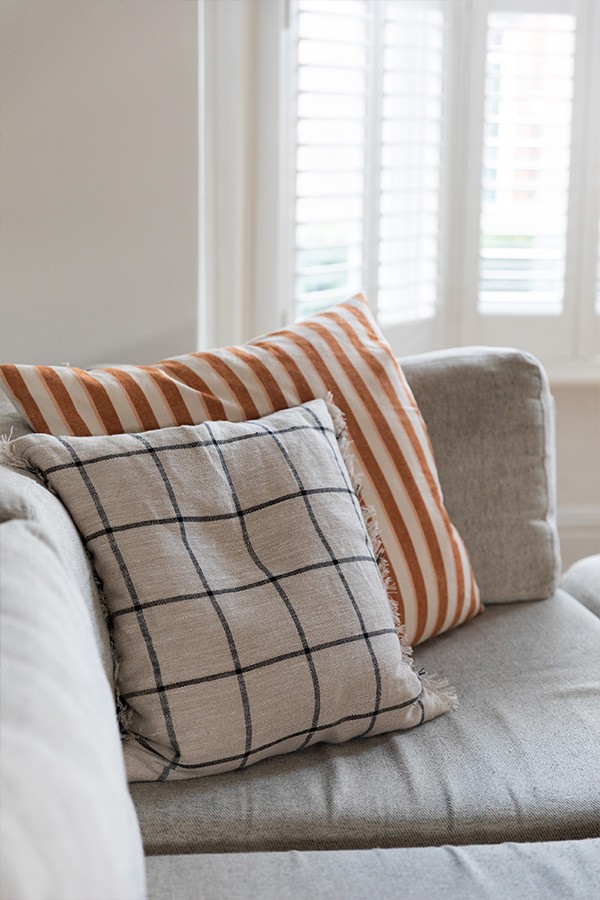 ferm LIVING Cushions on a grey sofa