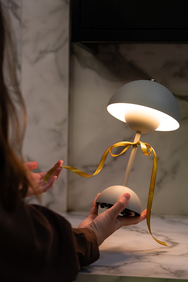 &Tradition VP9 Table Lamp with a ribbon tied around it