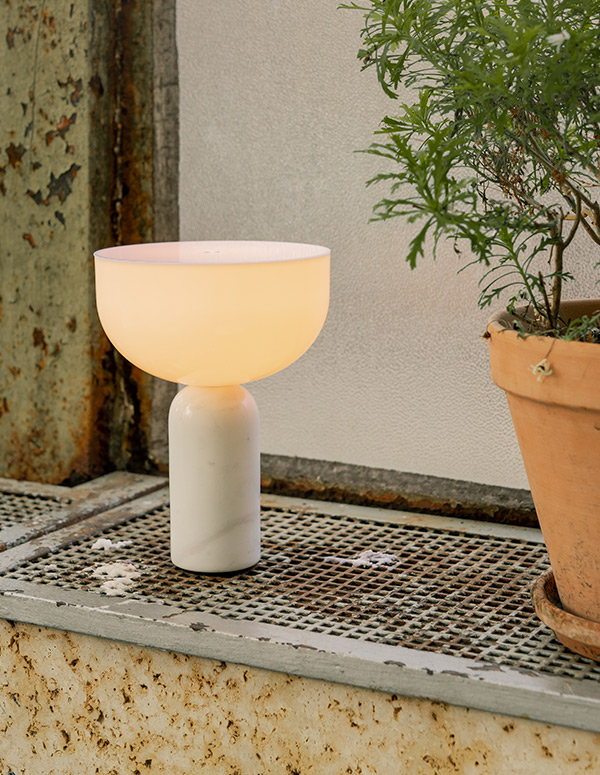 New Works Kizu Portable Table Lamp used outdoors