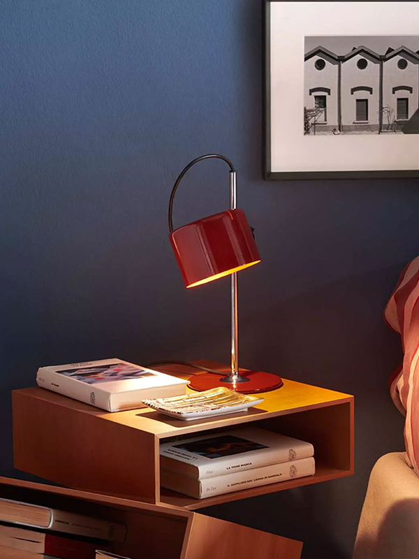 Oluce Coupe Table Lamp on a bedside table