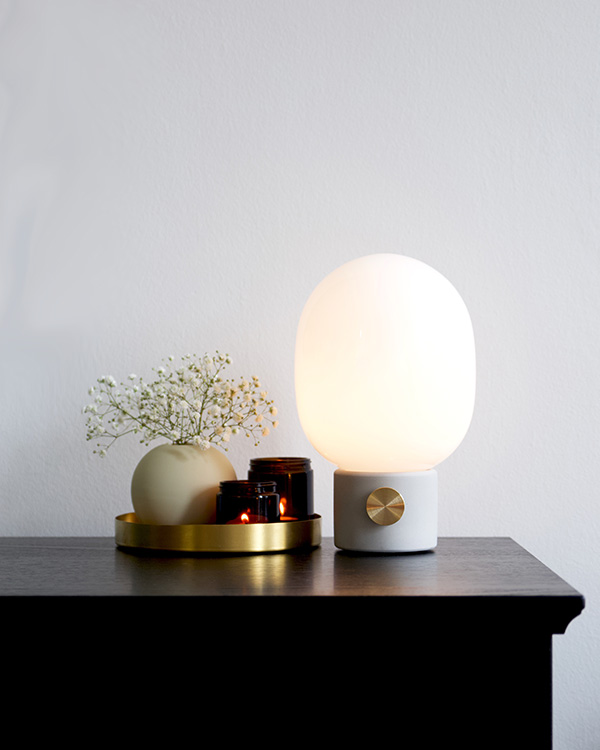 Audo JWDA concrete table lamp on a wooden sideboard