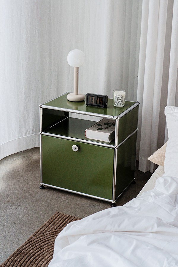 USM unit in Olive green by the bedside
