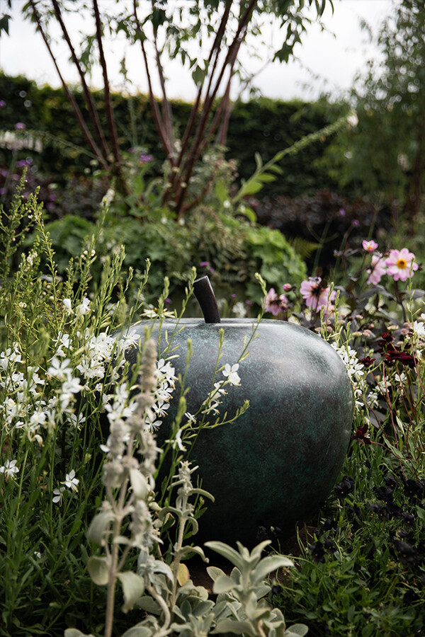 Close-up of a Bronze Apple sculpture in the Traditional Townhouse Garden