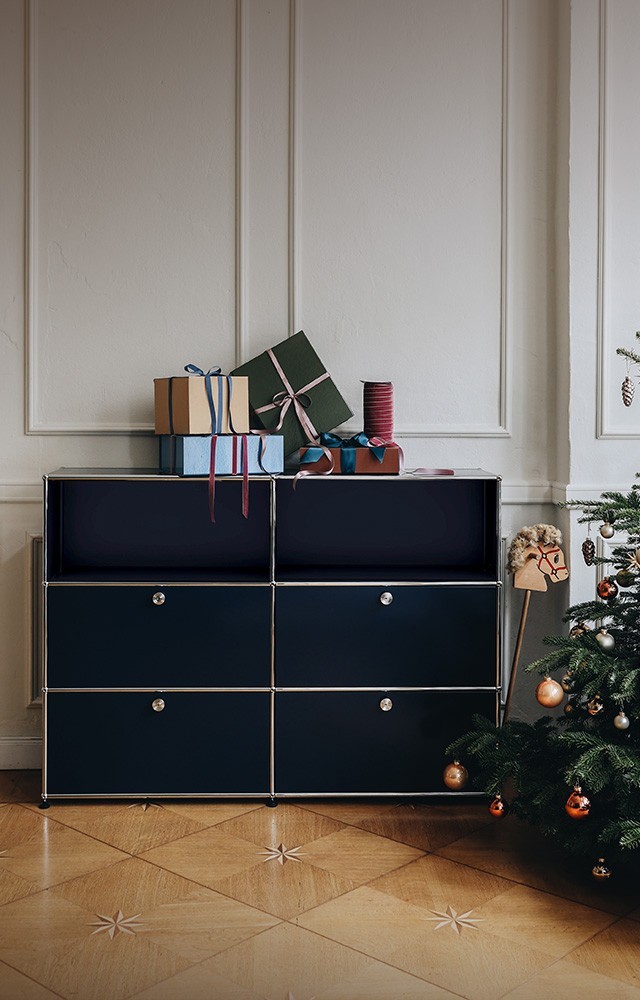 USM Haller Unit pictured in Christmassy living room settting with gifts and a festive tree 