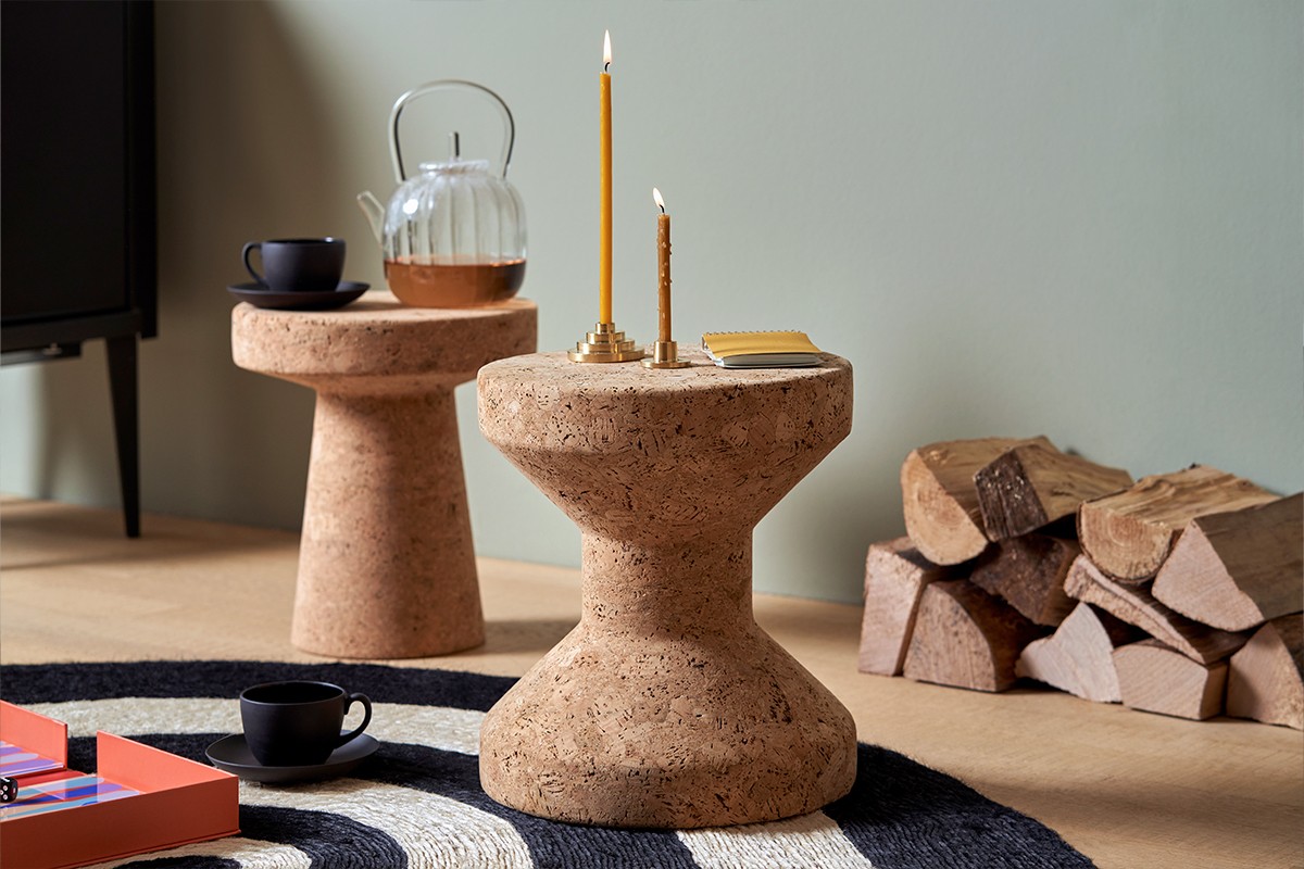 Vitra Cork Family Model A & C in living room setting with circular rug and wood logs