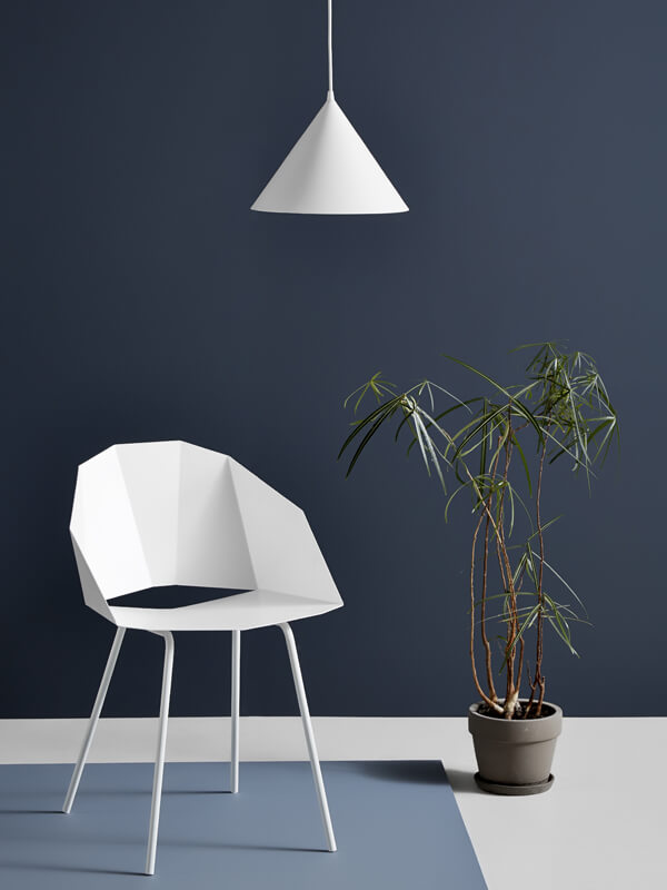 White Woud Annular Pendant Light above a white chair