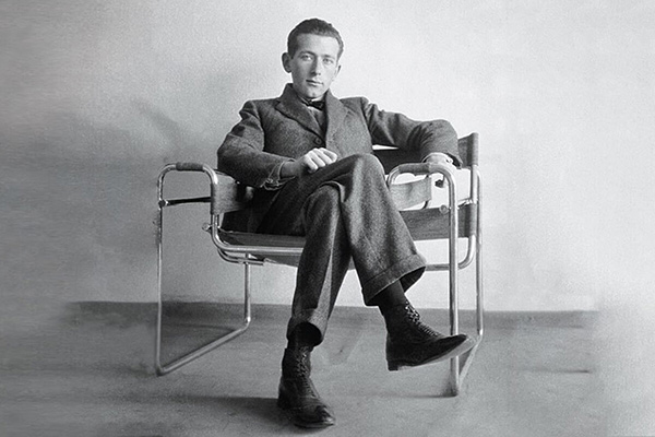 Designer Marcel Breuer sitting in his iconic Wassily Chair