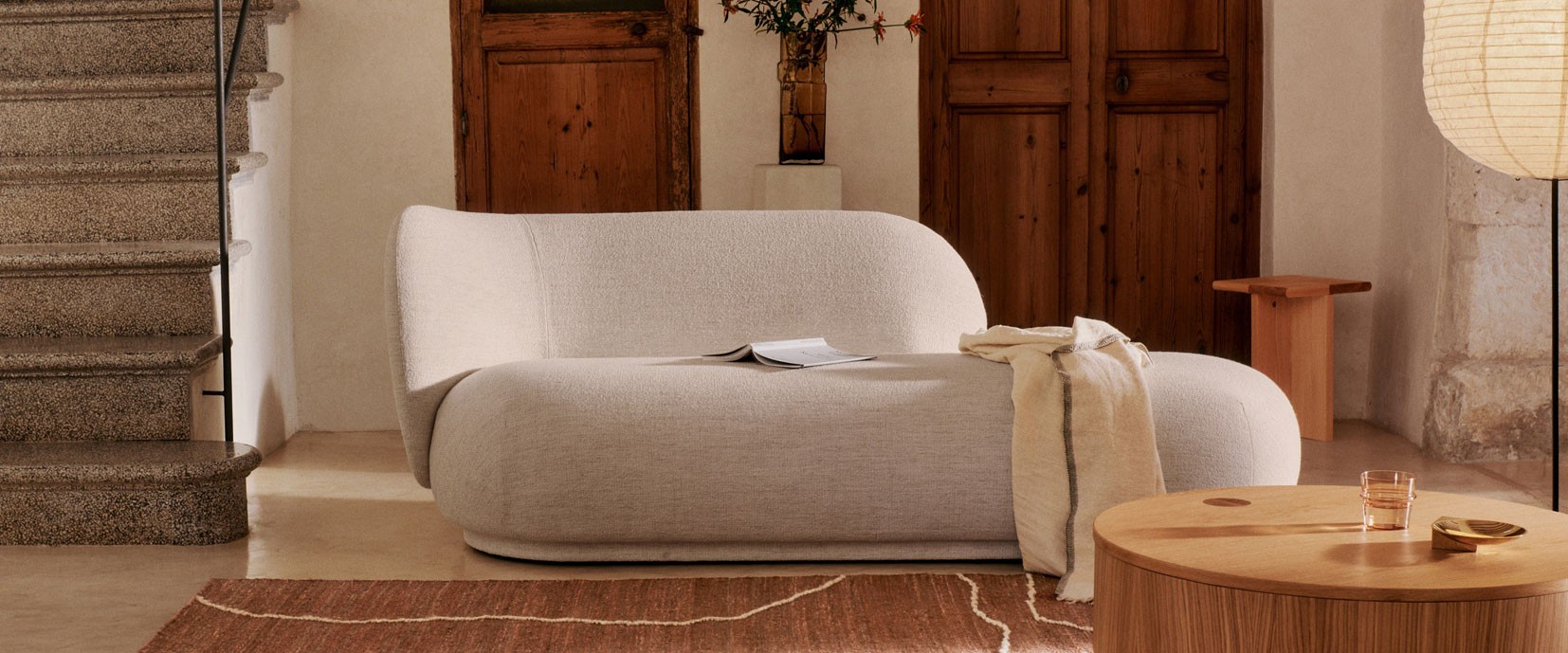 Light Grey Ferm Living Rico Divan with a rug and coffee table