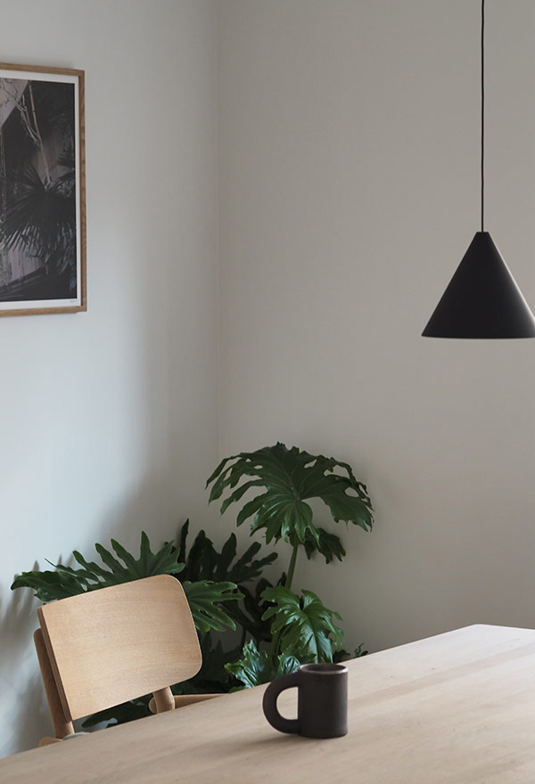 Hannah Trickett's dining room featuring the Flos string cone light & the Skagerak by Fritz Hansen Hven Armchair