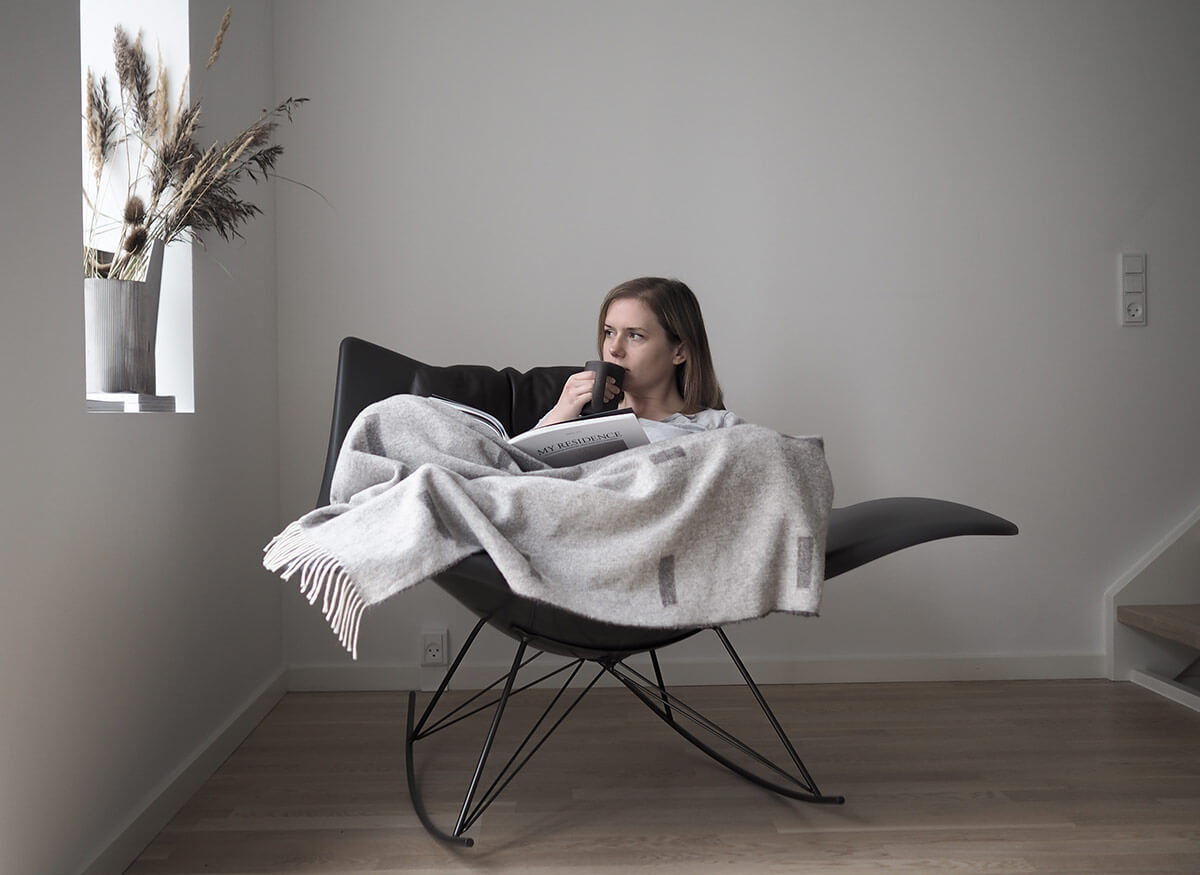 Interior Stylist Hannah Tricket in the Stingray Rocking Chair by Fredericia