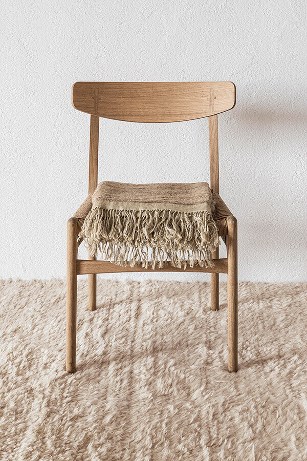 Wooden Chair on the nanimarquina Wellbeing Wool Chobi Rug