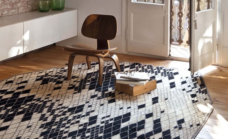 Walnut Lounge Chair on a black and white patterned rug