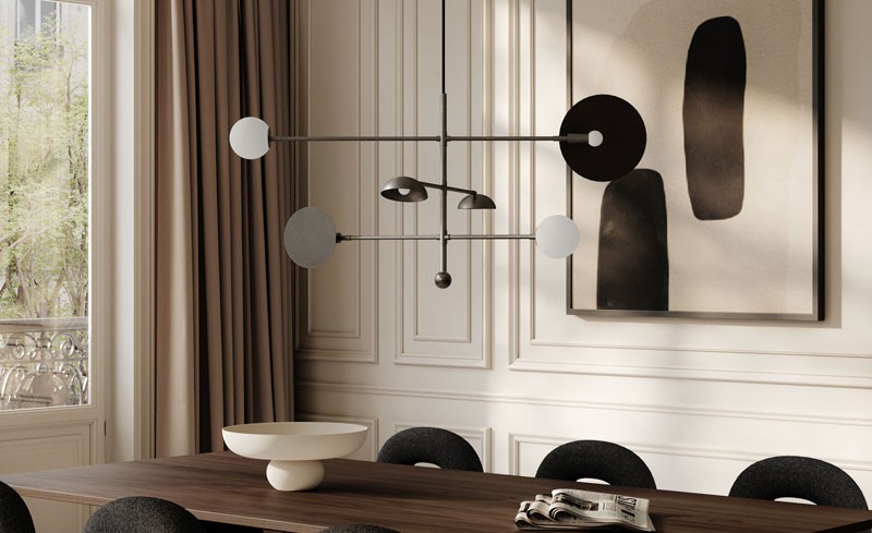 Modern chandelier hanging above a wooden dining table