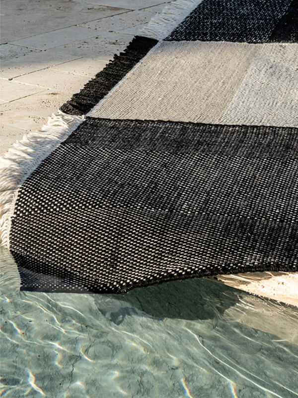 nanimarquina Tres Outdoor Rug by a pool